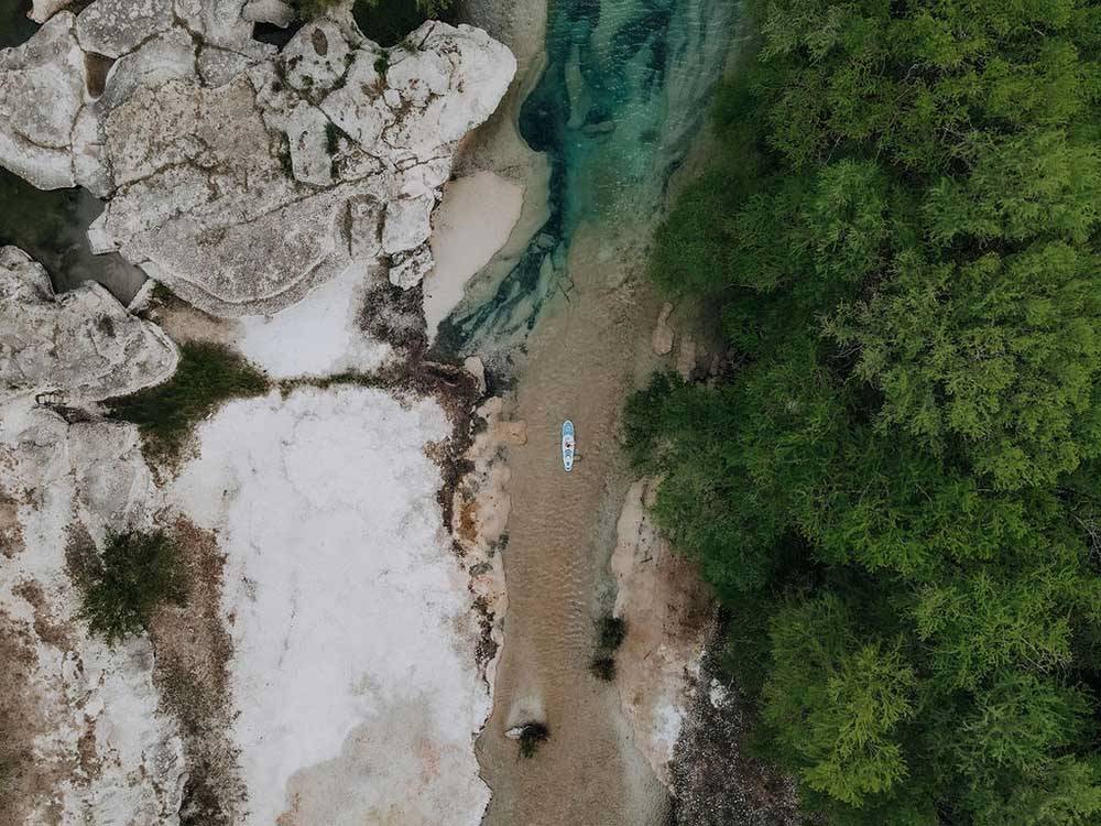 Aerial view of a paddle board in the river at CAMP COLD SPRINGS