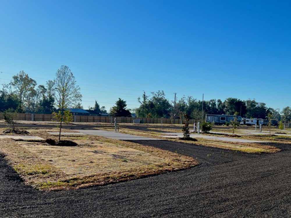 A row of empty paved sites at THE STATION RV RESORT