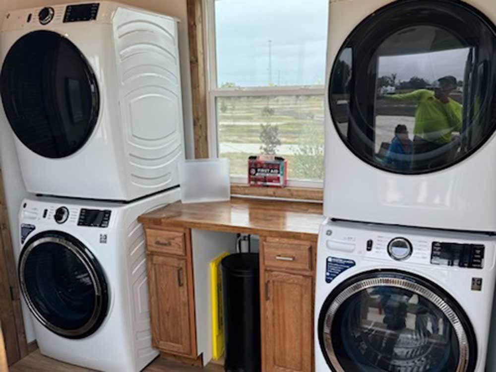 Washers and dryers in the laundry room at THE STATION RV RESORT