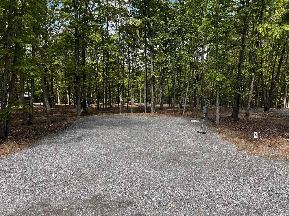 An empty gravel RV site at CLOUD CAMP