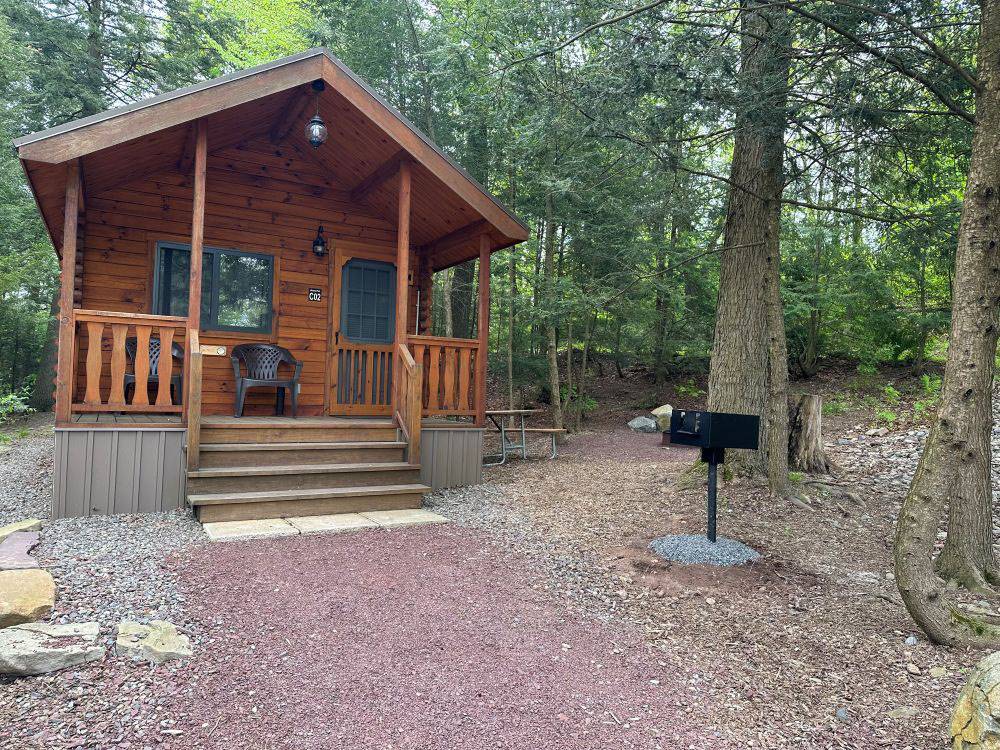 A rustic rental cabin with a porch
