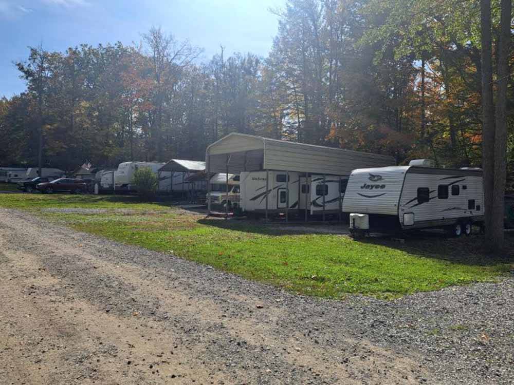 RVs and trailers parked on gravel sites at GLENDALE VALLEY CAMPGROUND