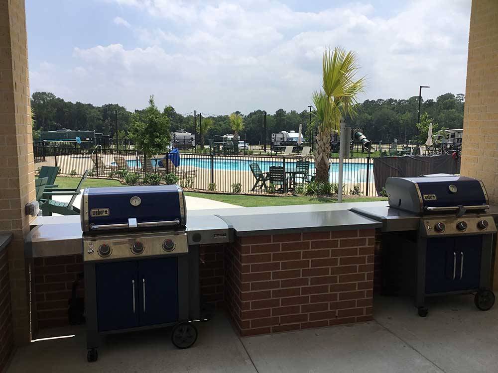 The barbeque area looking at the swimming pool at LAUREL SPRINGS RV RESORT