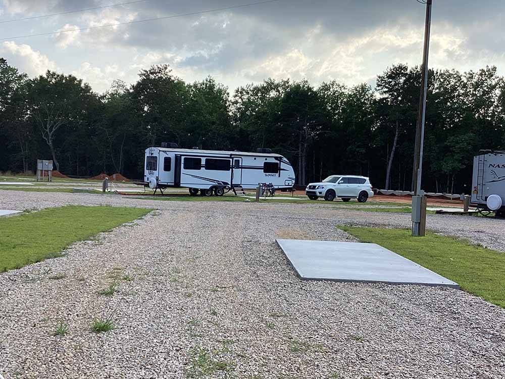 Another view of an empty site at KELLY CREEK RV PARK