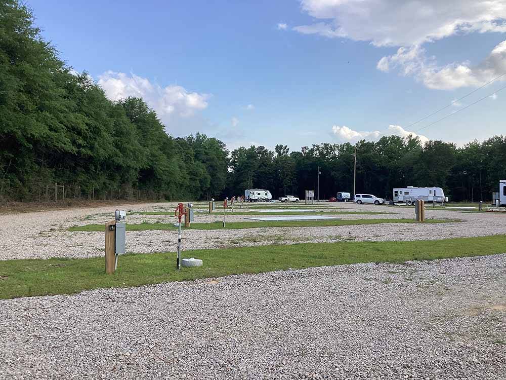 A row of the gravel sites at KELLY CREEK RV PARK