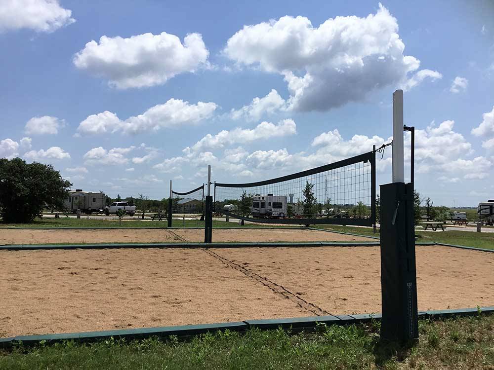 The sand volleyball court at SCHATZILAND RV RESORT
