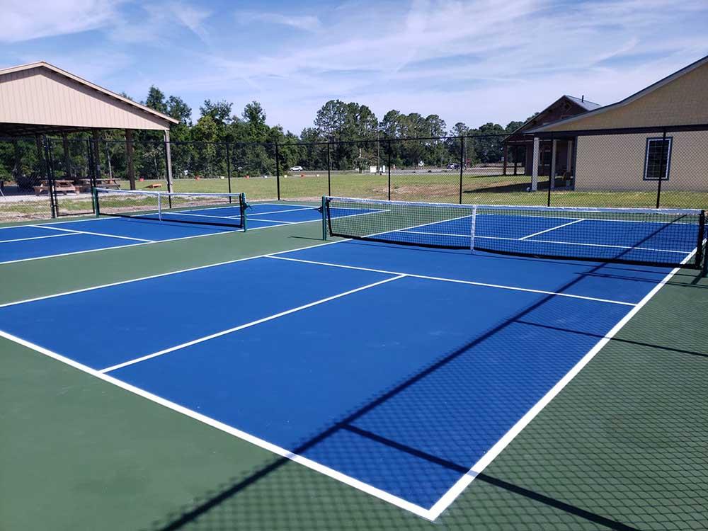 The bright blue tennis ball courts at STRAWBERRY FIELDS FOR RV'ERS