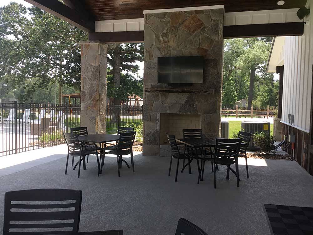 The sitting area next to the swimming pool at TWO CREEKS CROSSING RV RESORT