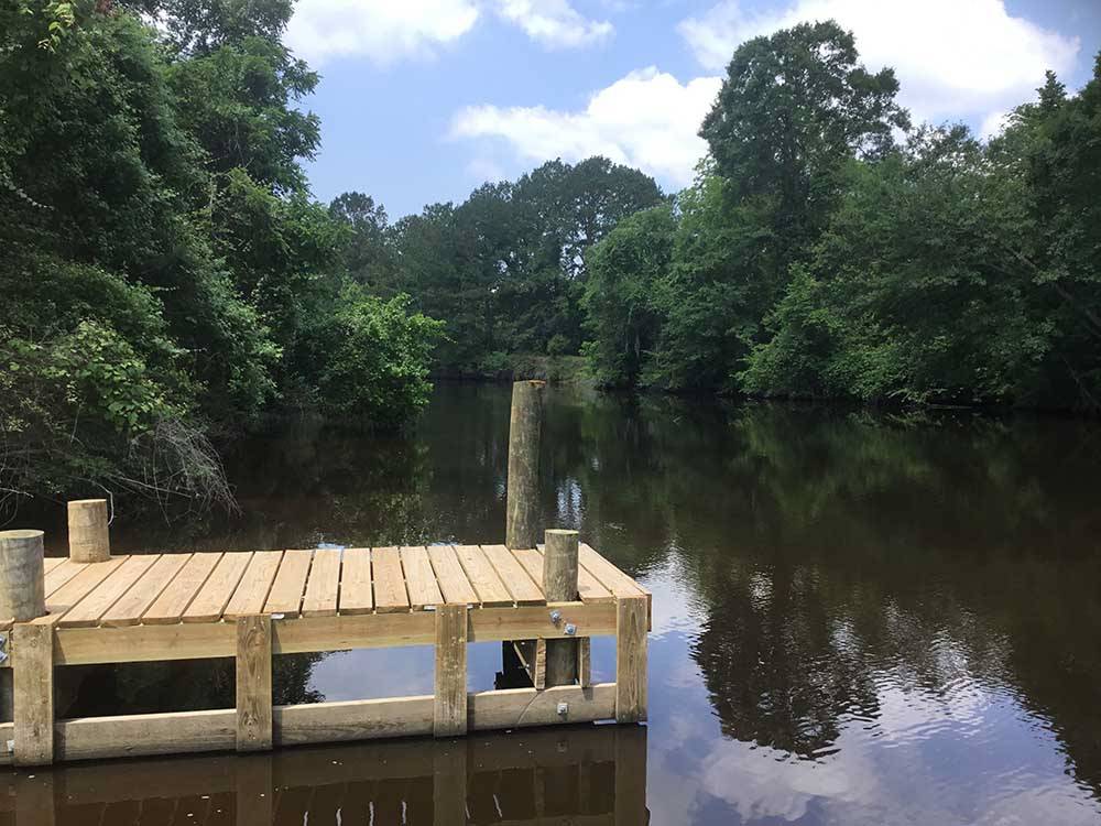 The dock in the catch and release pond at TWO CREEKS CROSSING RV RESORT