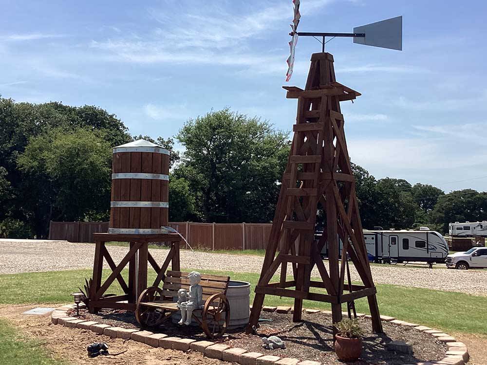 A windmill and water tower at OLD TOWNE RV RANCH