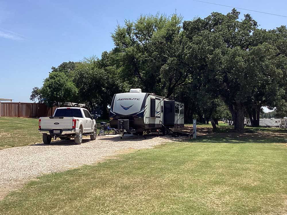 A fifth wheel trailer parked in a back in site at OLD TOWNE RV RANCH