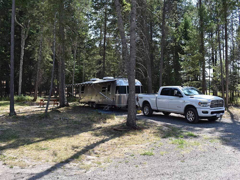 A travel trailer parked at Whispering Pines RV Park