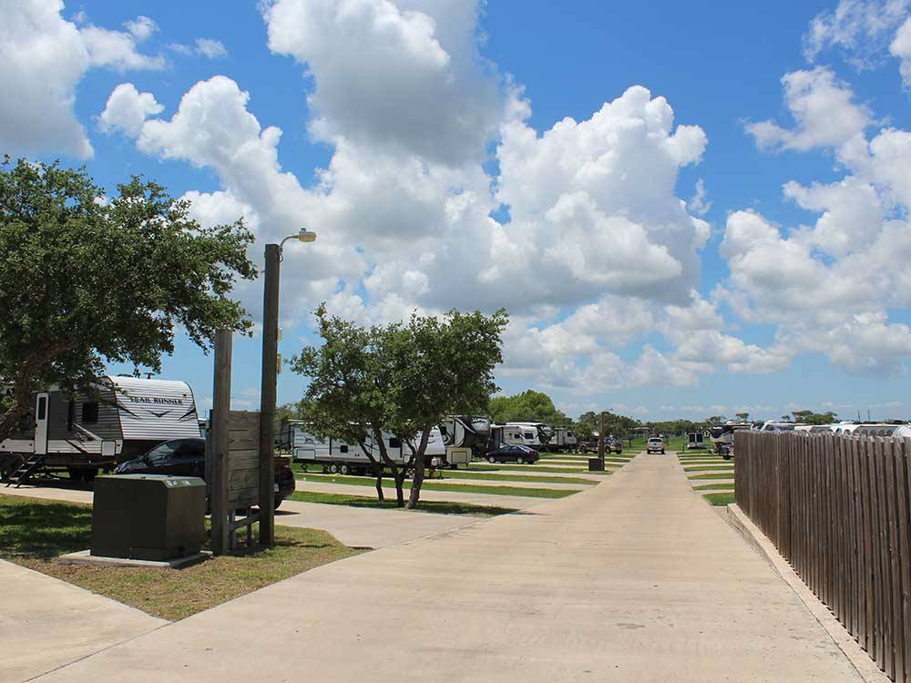 A walking path next to the paved sites at SEA GRASS RV RESORT