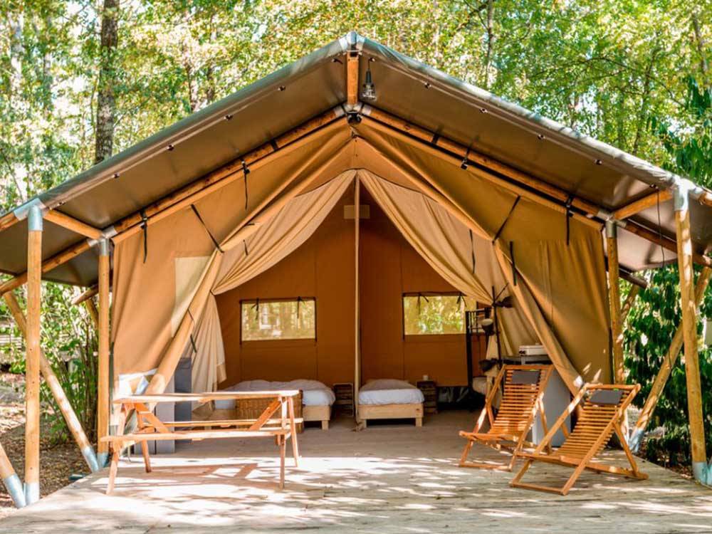 The front view of one of the glamping tents at DANCING FIRE GLAMPING AND RV RESORT