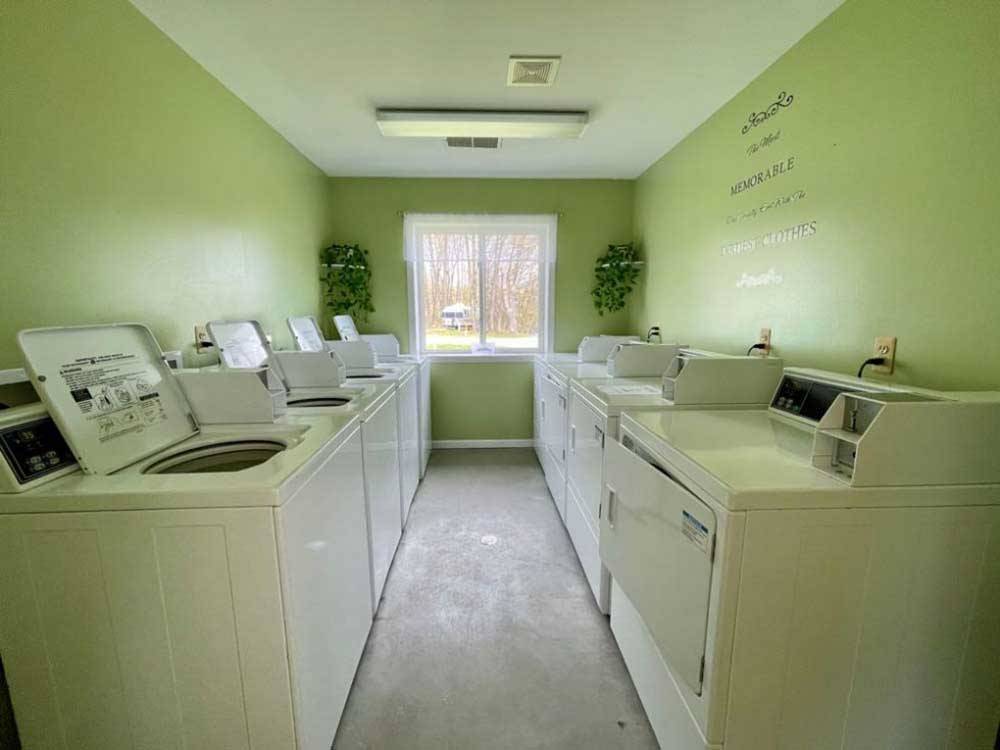 Washers and dryers in the laundry room at DANCING FIRE GLAMPING AND RV RESORT