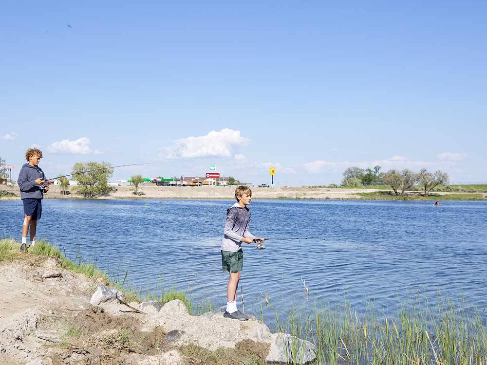 Two boys fishing at the lake at LUCKY LAKE 208