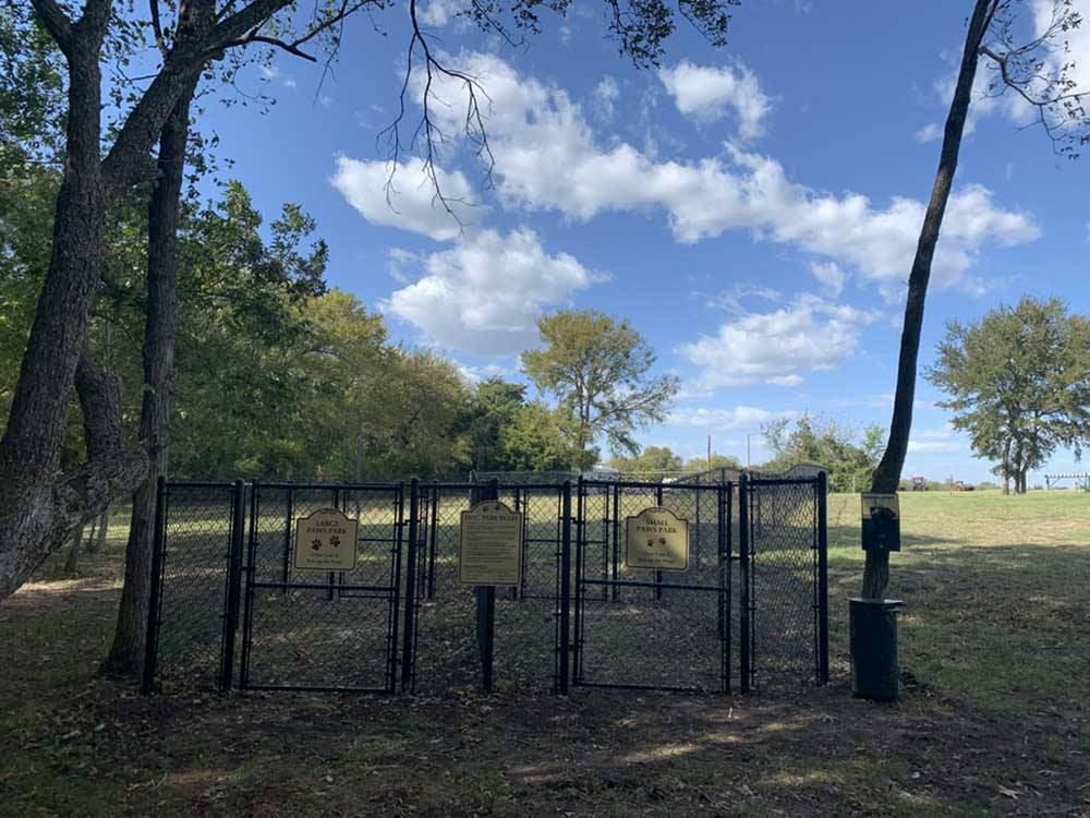 The fenced in dog park area at SUNDOWNER RV PARK