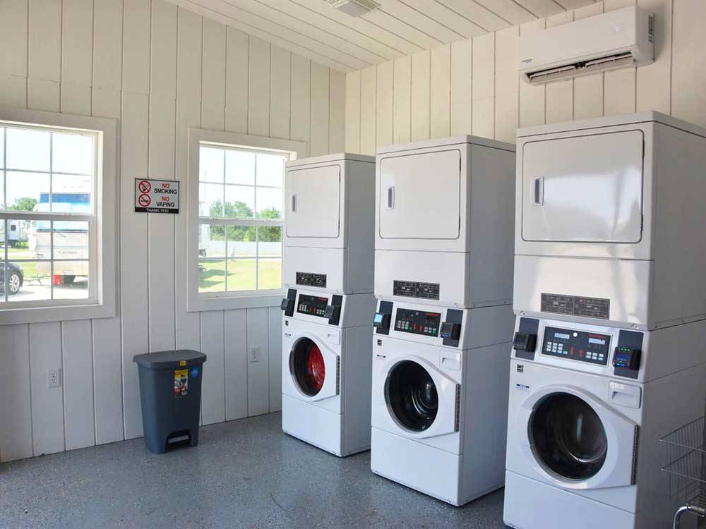 Three stackable washer and dryers at THE RV RESORT