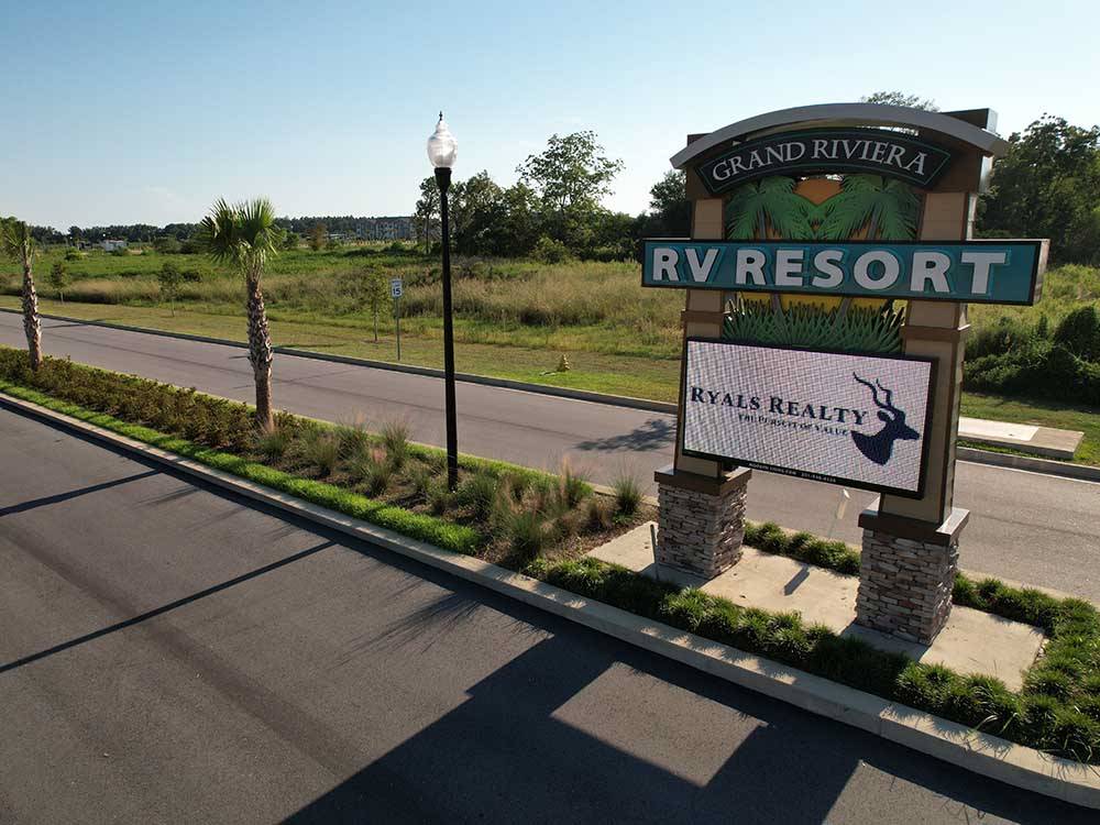 The front entrance sign at GRAND RIVIERA RV RESORT