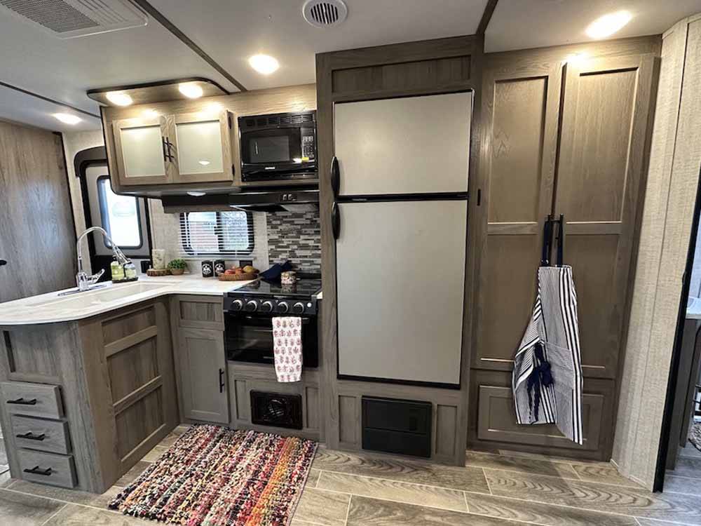 The kitchen inside a trailer at ROARING RIVER HILLS CAMPGROUND AND CABINS