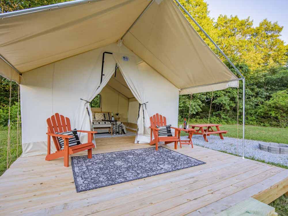 Outside a glamping tent at ROARING RIVER HILLS CAMPGROUND AND CABINS