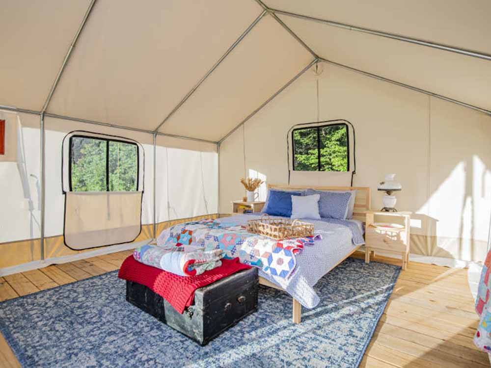The inside of a glamping tent at ROARING RIVER HILLS CAMPGROUND AND CABINS