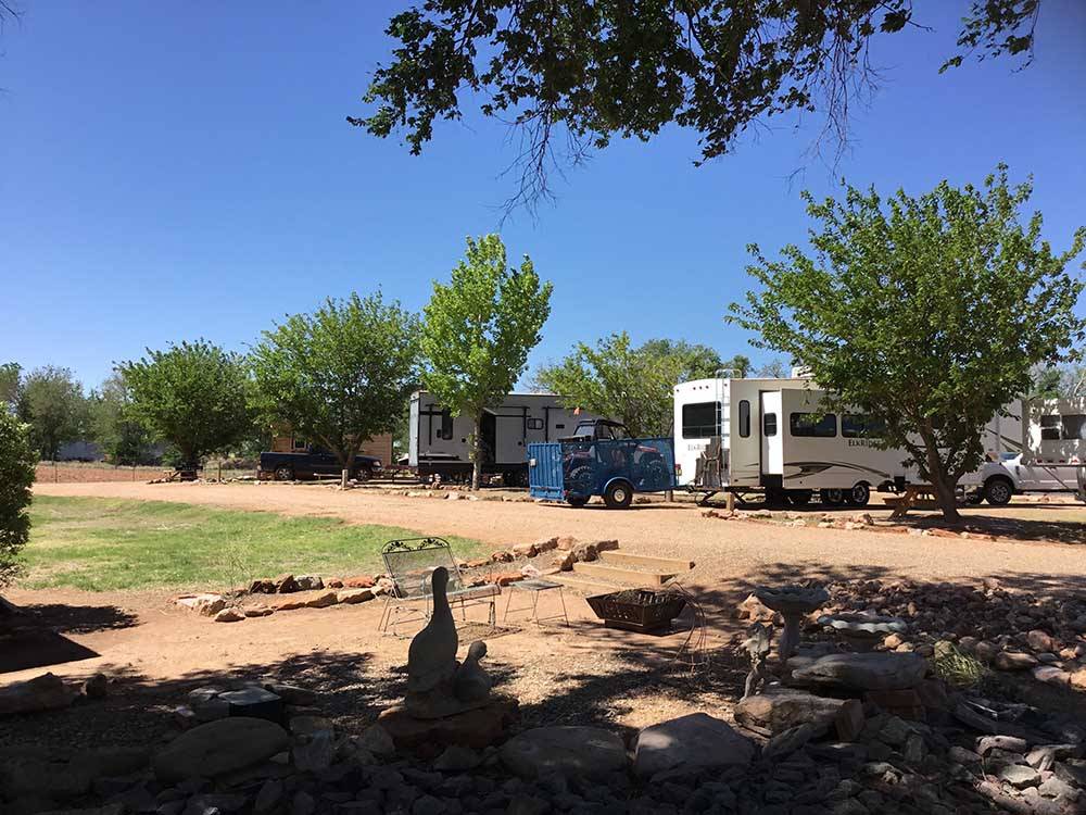 A row of trailers parked in RV sites at SHEPHERD FAMILY CABINS & RV CAMPGROUND