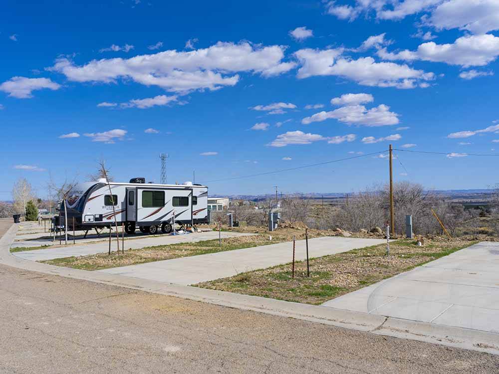 Two empty paved RV sites at ESQUIRE ESTATES MH & RV PARK