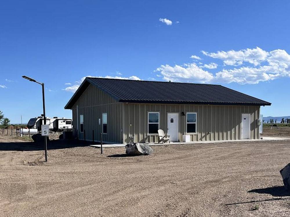 Large building with white doors at SAN LUIS VALLEY RV RESORT