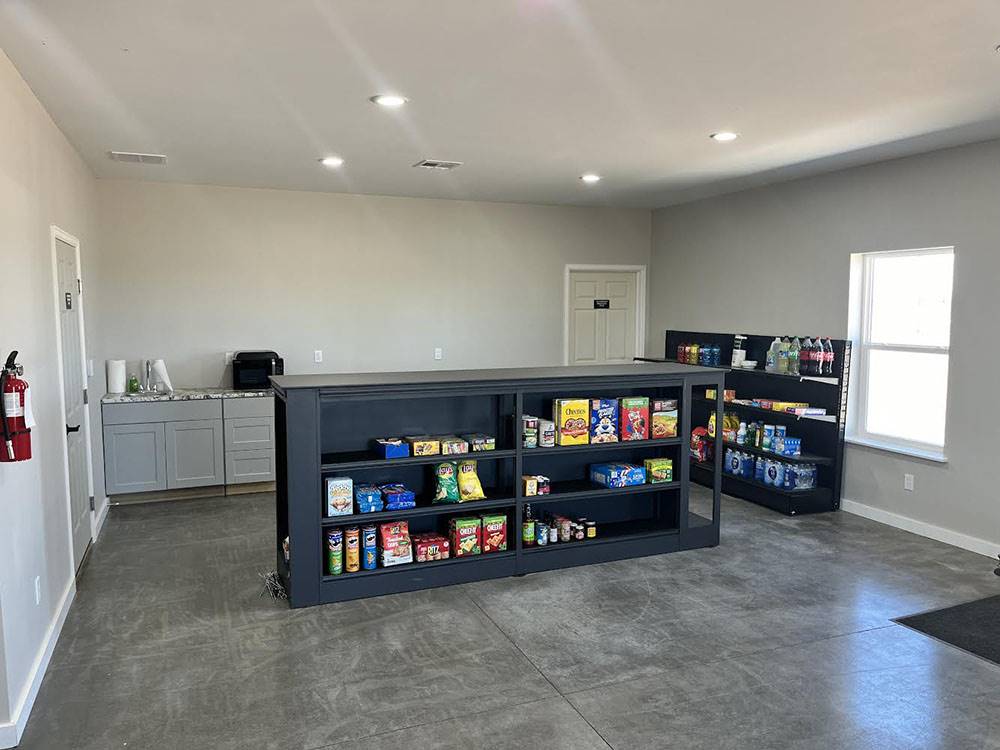 Interior of building with shelves at SAN LUIS VALLEY RV RESORT