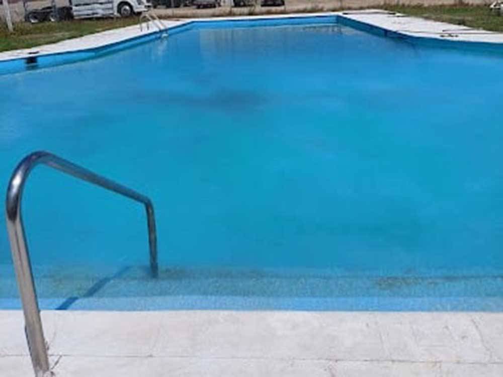 The empty swimming pool awaits you at HEAVENLY WATERS RV PARK