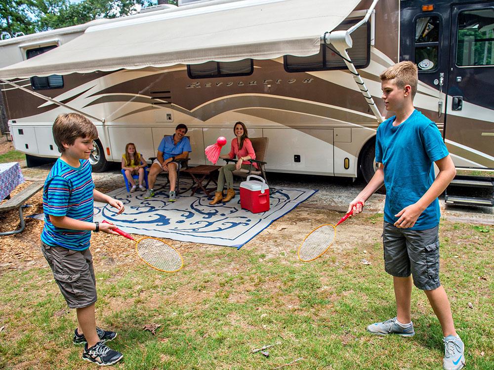 Children playing next to an RV at WILD ADVENTURES SAFARI CAMPGROUND