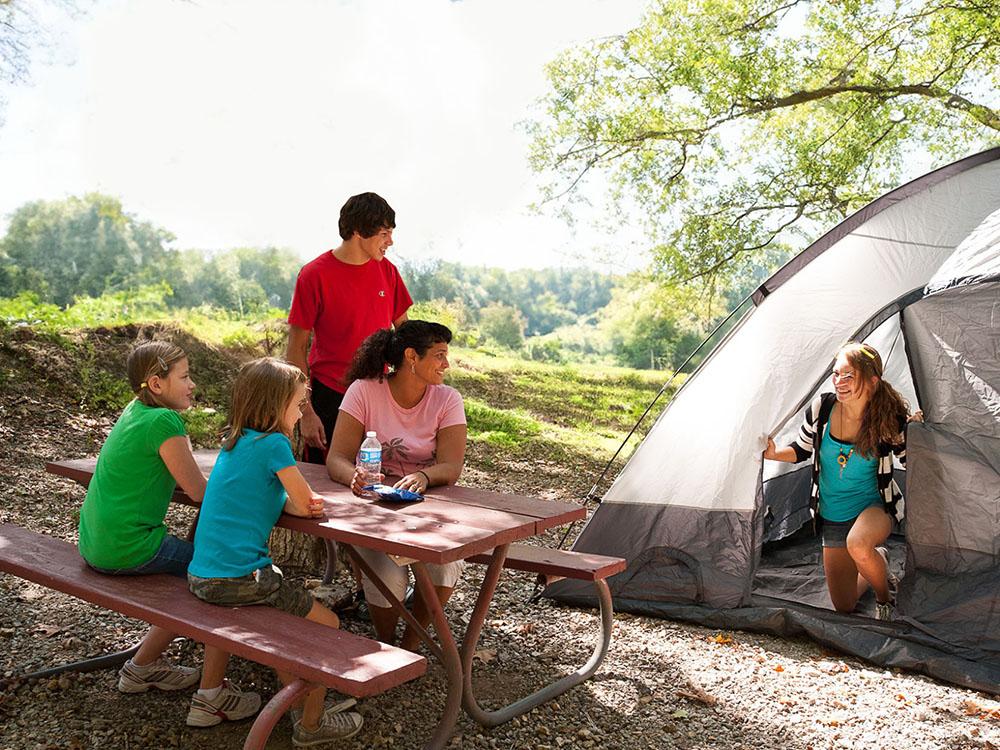 Table with tent campers at WILD ADVENTURES SAFARI CAMPGROUND