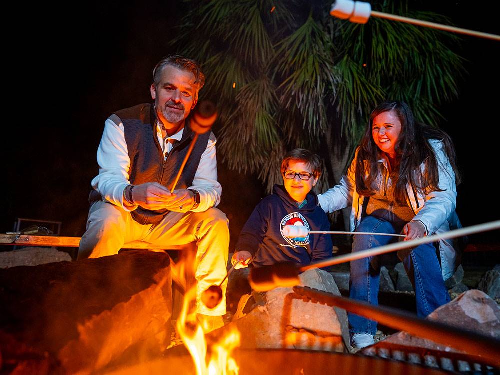 A family roasting marshmallows