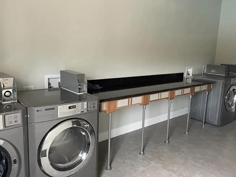 Inside of the clean laundry room at SANTA FE PALMS RV RESORT