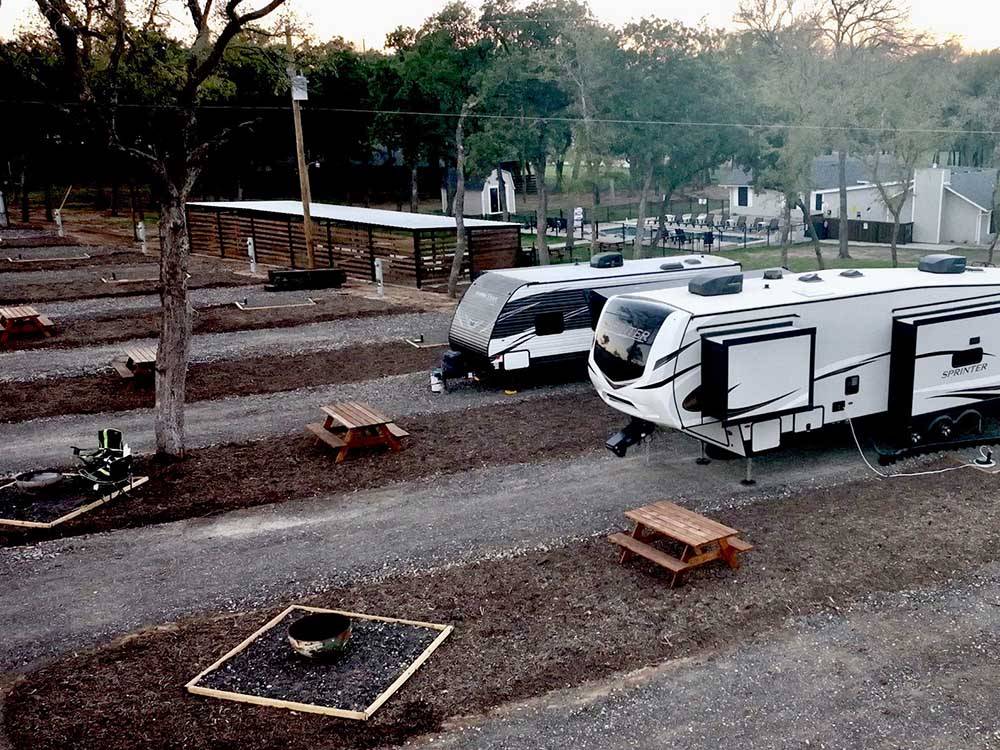 A view of two trailers in gravel sites at STARRY NIGHT RV RESORT