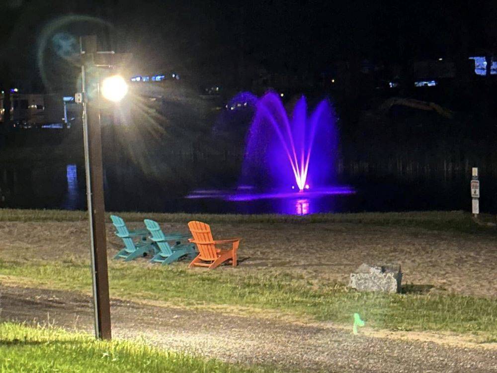 Seating to view the colorful fountain on the lake