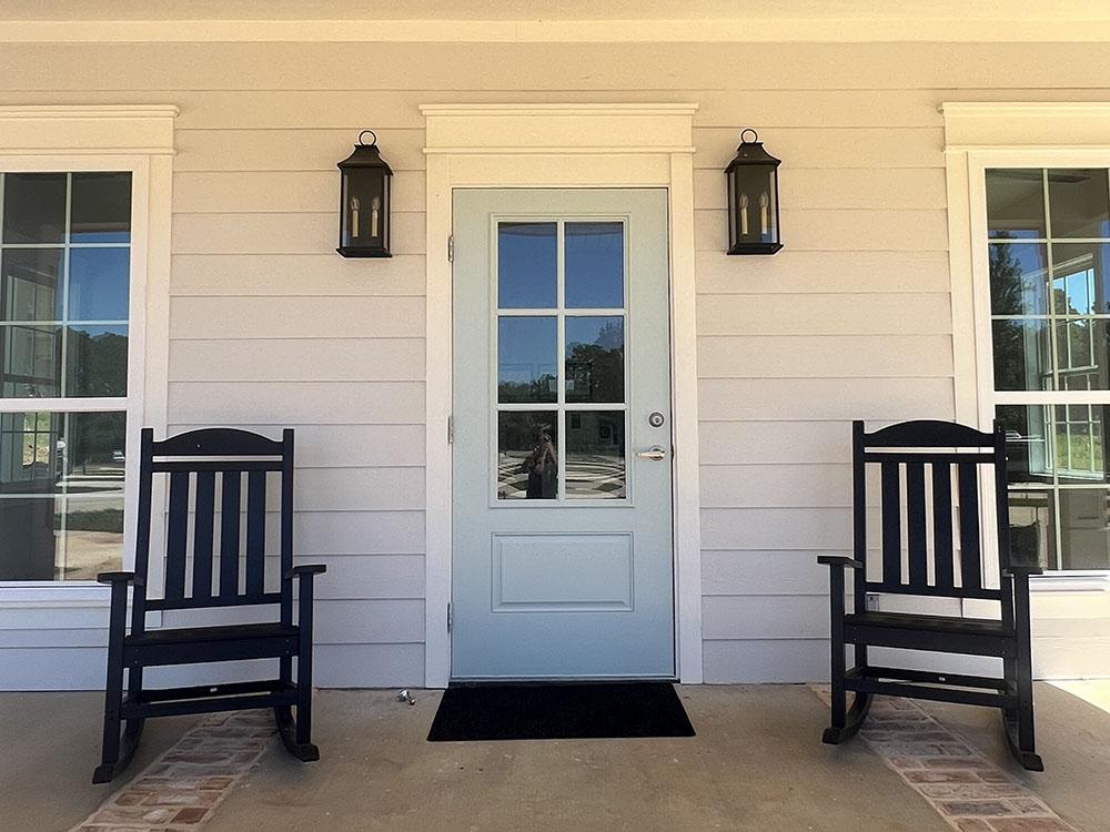 Front porch with two rocking chairs at STARRVILLE RV RESORT