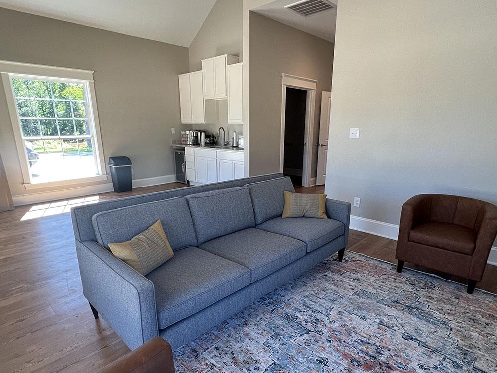 Seating area and kitchenette in the office lounge at STARRVILLE RV RESORT