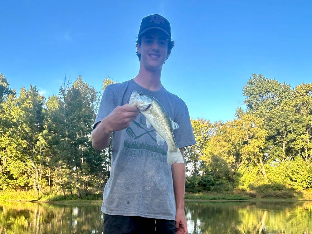 A young man holding his catch-of-the-day
