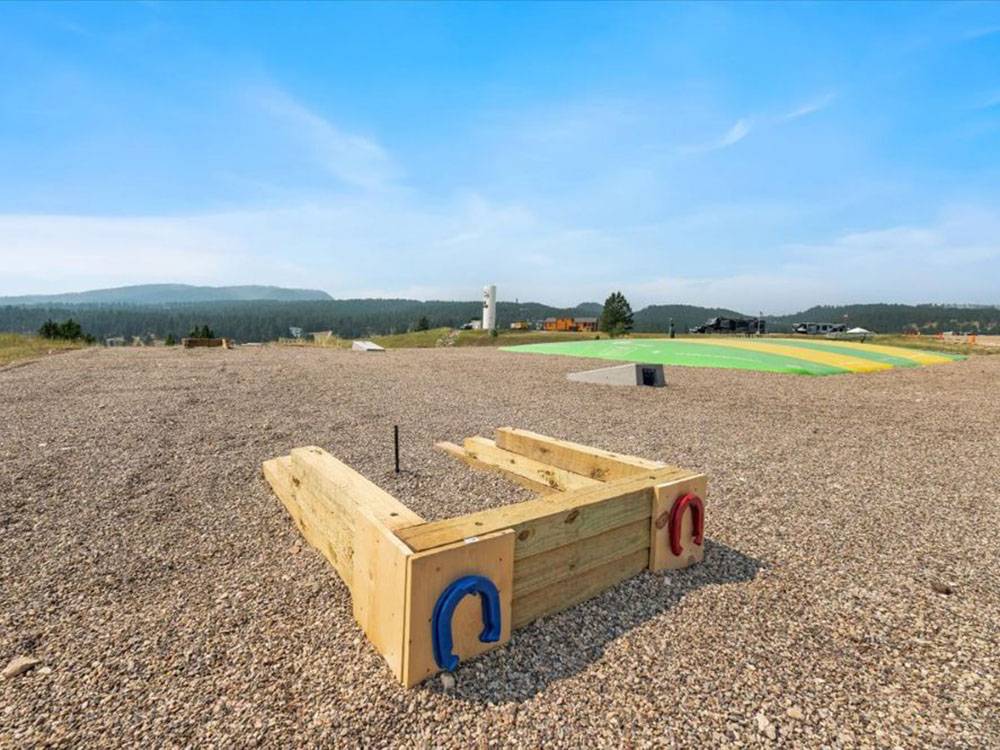 Horseshoe pit and jump pad