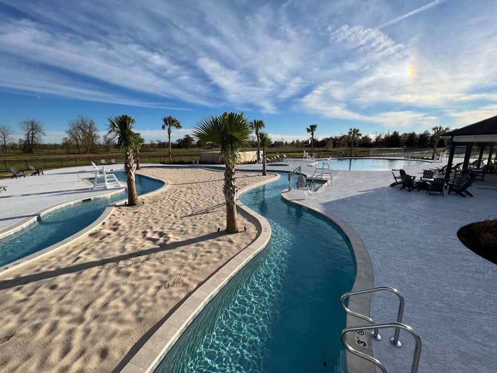A view of of the lazy river and swimming pool at TIGER'S TRAIL RV RESORT