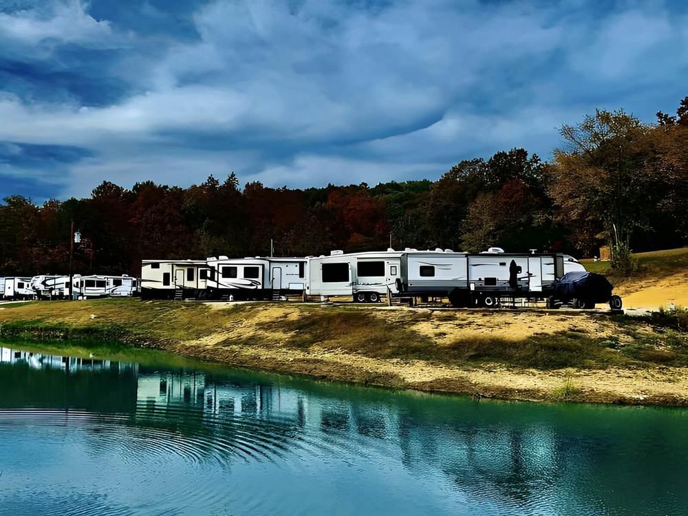 RVs by the water at Little Sinkin Creek RV Resort & UTV Campground