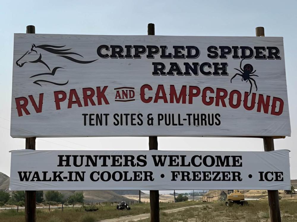 Welcome sign at site Crippled Spider RV Park & Campground