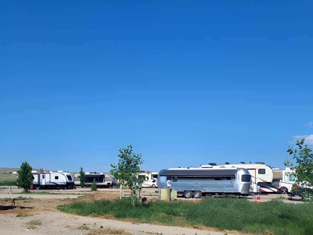 Parked trailers at site Crippled Spider RV Park & Campground