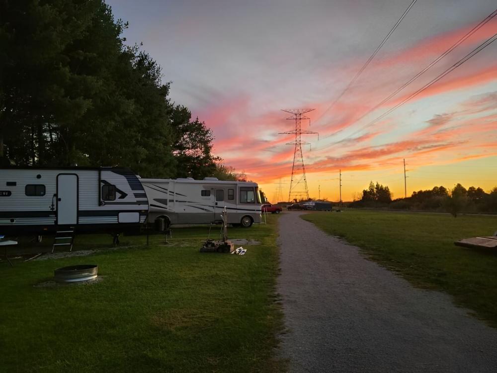 Parked trailer and RV at site Camp Sabroske