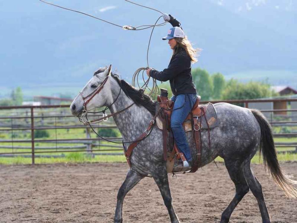 Person riding a horse at HAPI Trails Ranch