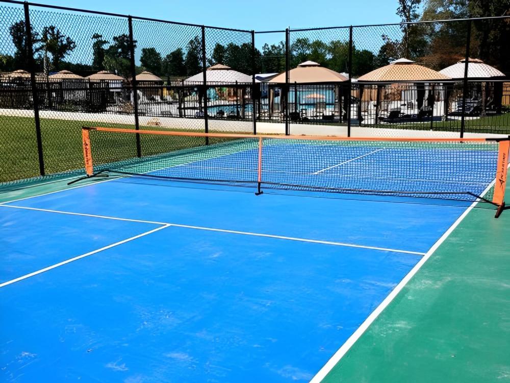 Pickleball courts and swimming area in background