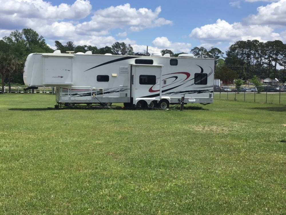 5th wheel in a grass area at 341 RV Park