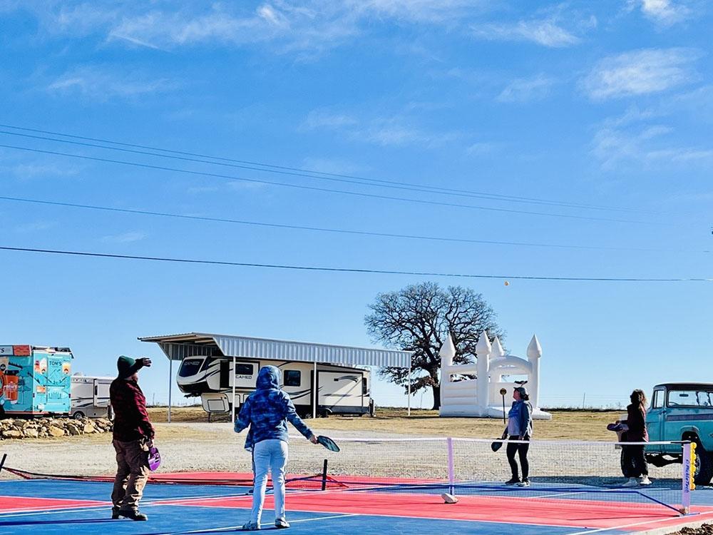 A couple of guest playing pickle ball at FLYING HORSE RV PARK